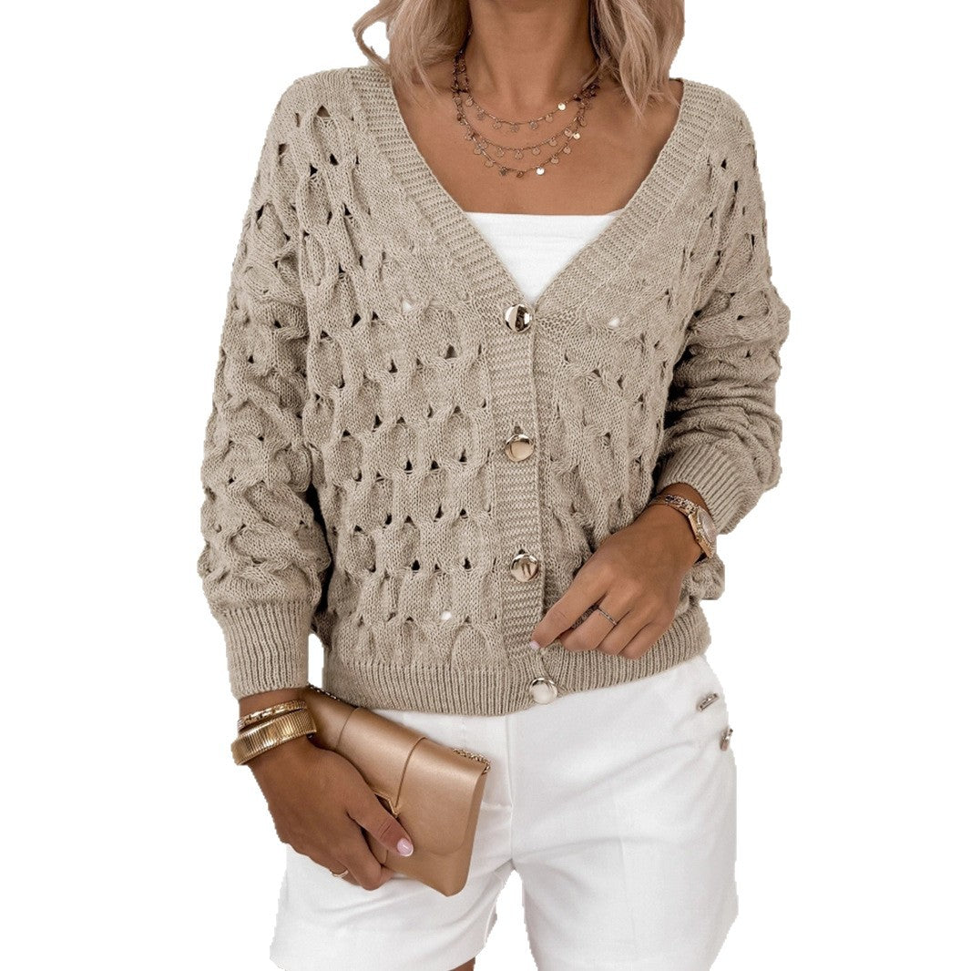Veste en tricot pour femmes avec une structure en mailles aérées et des détails de boutons élégants Chic und Stil