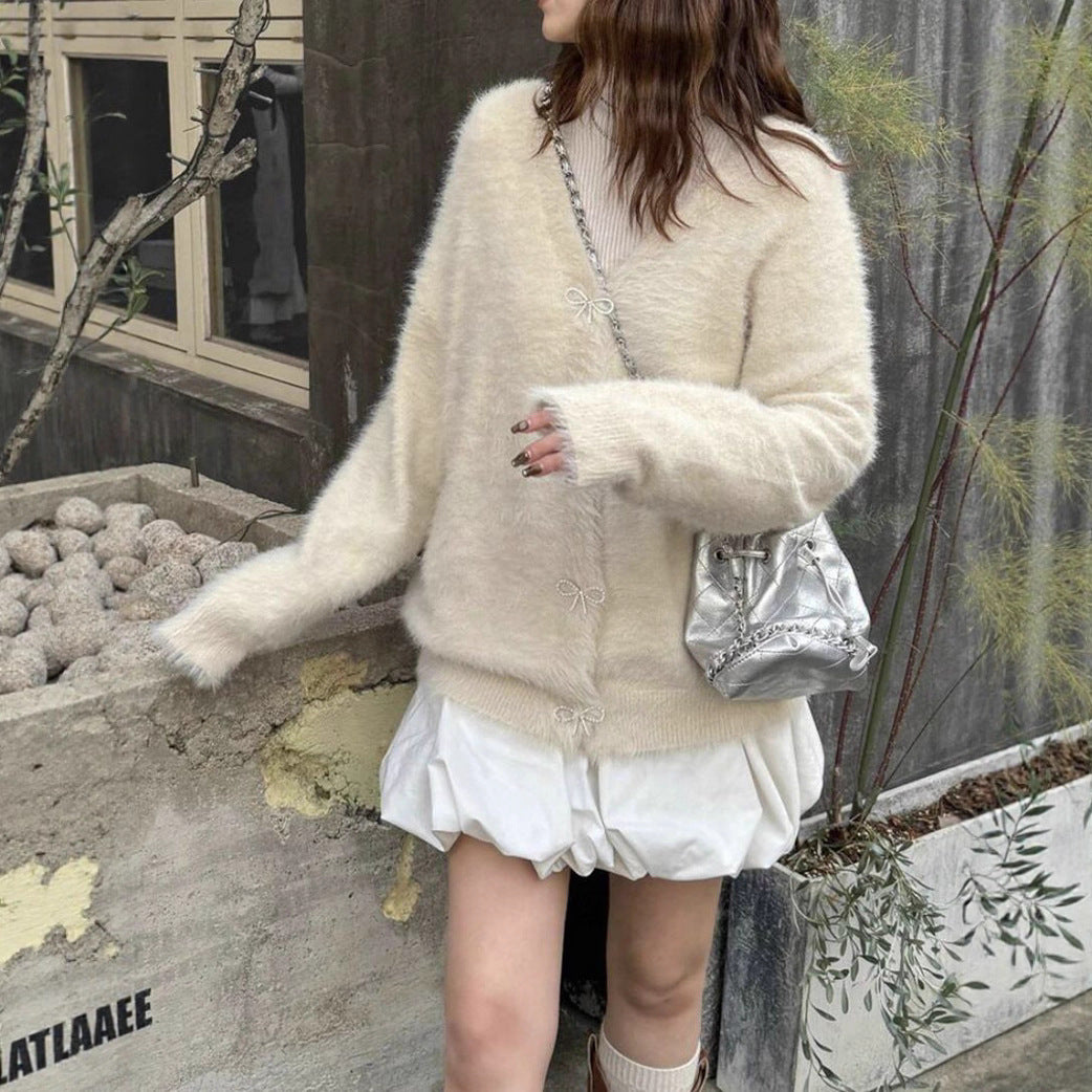 Dames Pull en maille pelucheux avec des détails de boutons élégants Chic und Stil