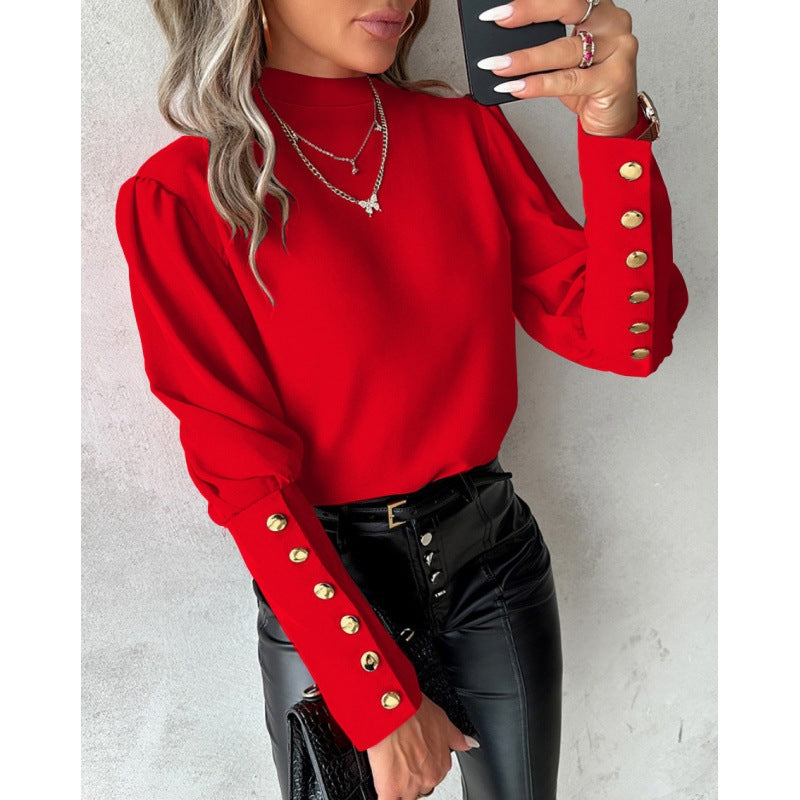 Blouse élégante pour femmes avec des manches bouffantes et des détails de boutons dorés Chic und Stil