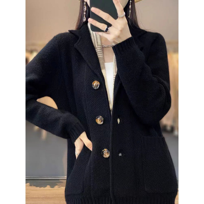 Women's cozy knit vest with large pockets and elegant button closure. Chic and stylish.