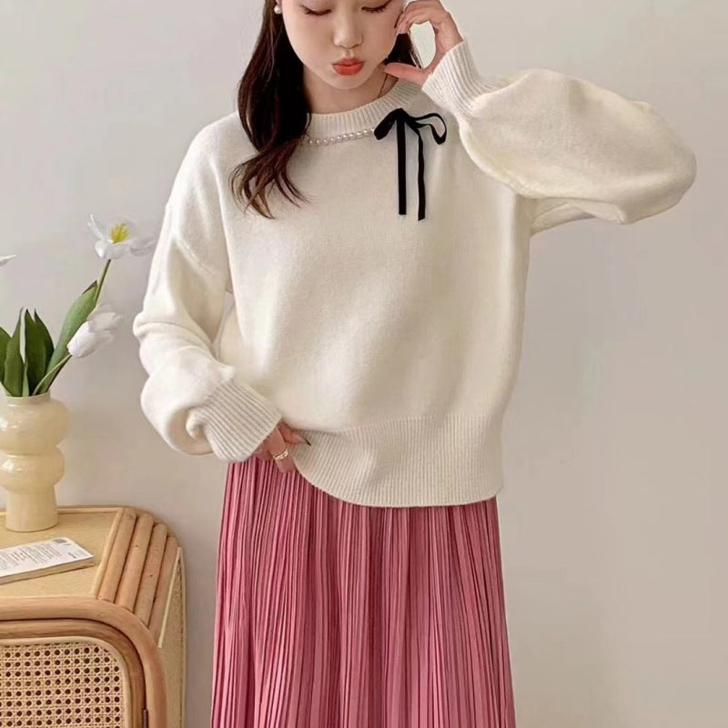 Dames pull mode avec bande décorative et détails en perles Chic und Stil