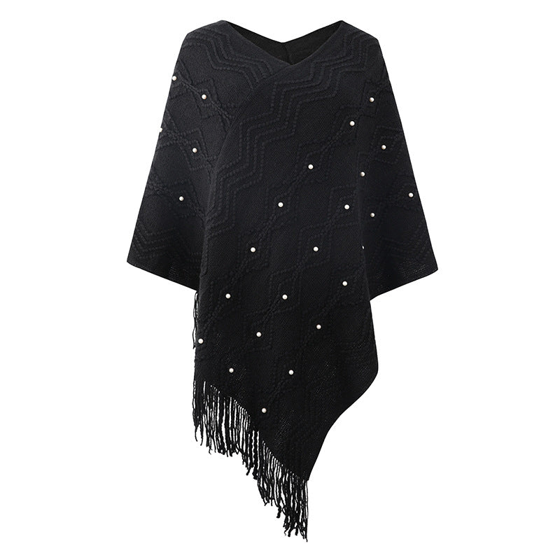Chic and Style Elegant poncho for women with a striking textured pattern and decorative fringes