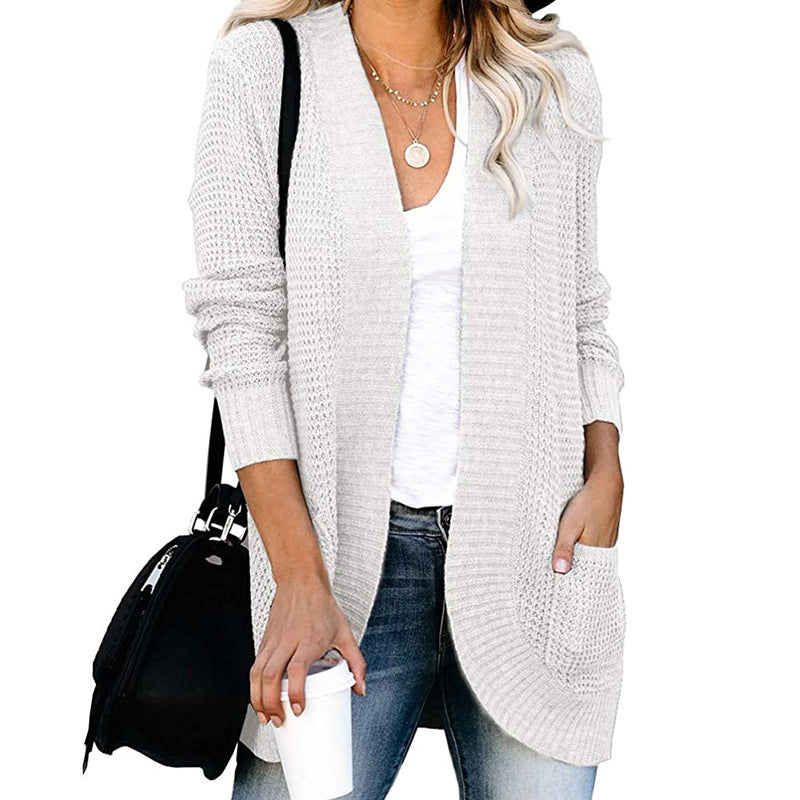 Veste en tricot pour femmes avec un motif de tricot moderne et des poches pratiques Chic und Stil