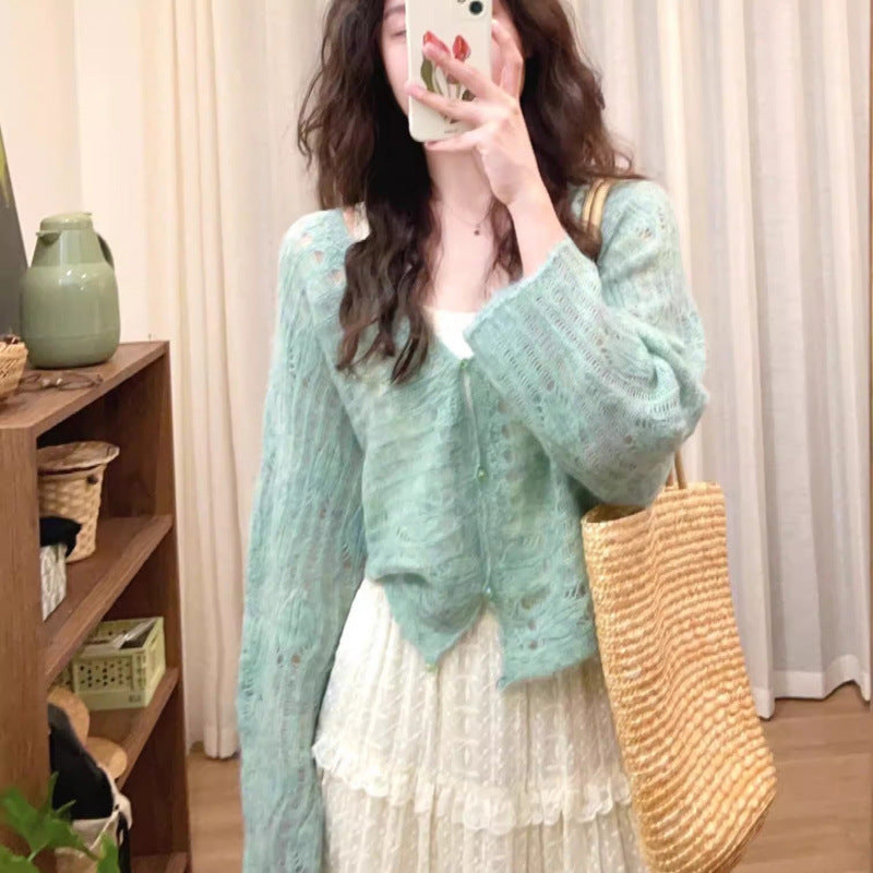 Cardigan en tricot léger pour femmes avec une fine structure en mailles ajourées et une coupe ample Chic und Stil