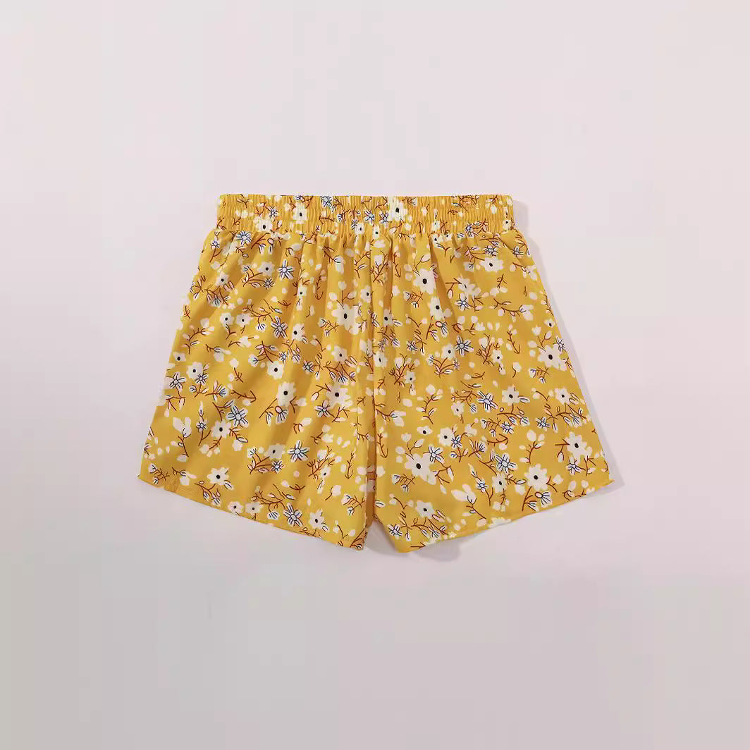 Shorts fleuris pour femmes avec taille élastique et poches latérales Chic und Stil