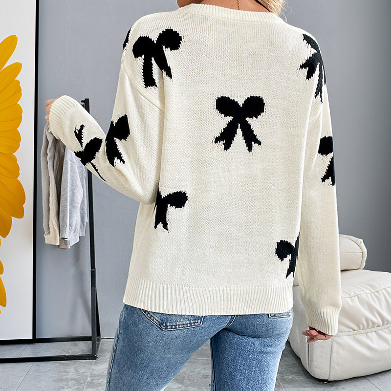 Dames Pull doux avec un motif nœud ludique Chic und Stil