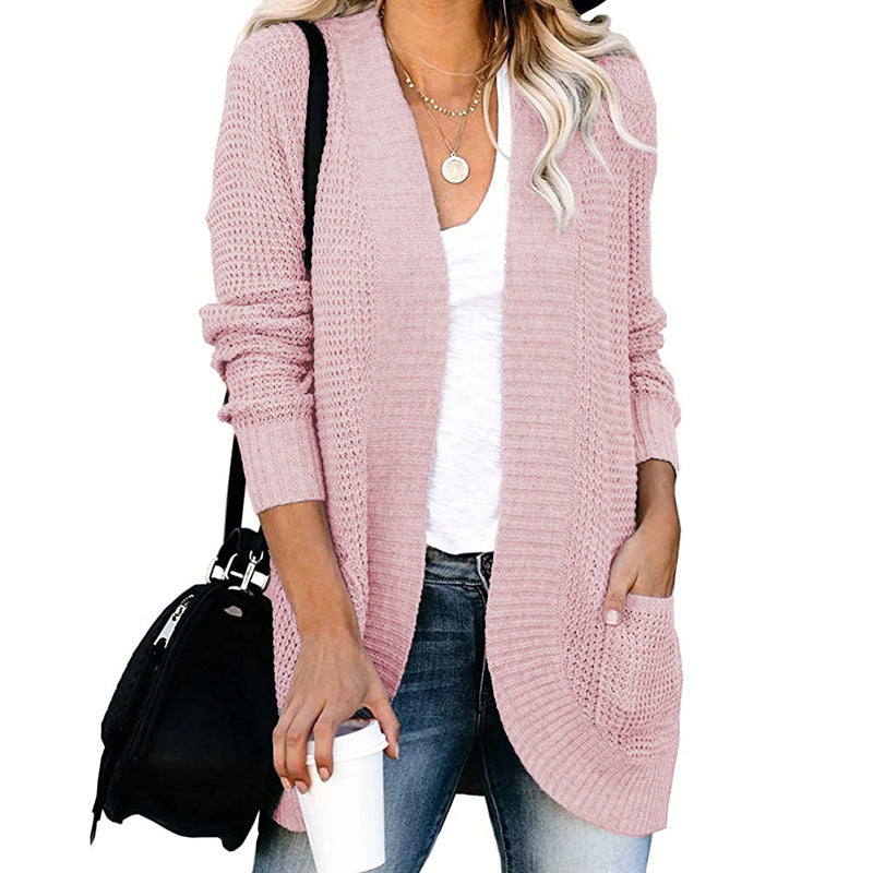 Veste en tricot pour femmes avec un motif de tricot moderne et des poches pratiques Chic und Stil