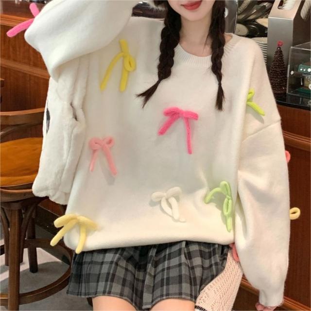Pull décontracté pour femmes avec des appliqués de nœuds ludiques Chic und Stil