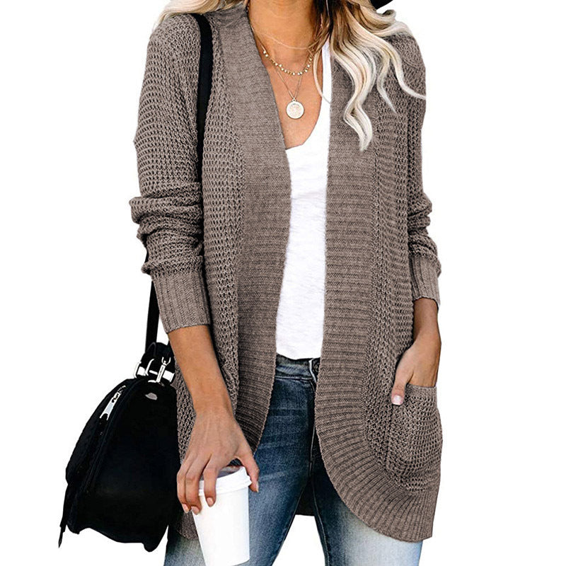Veste en tricot pour femmes avec un motif de tricot moderne et des poches pratiques Chic und Stil