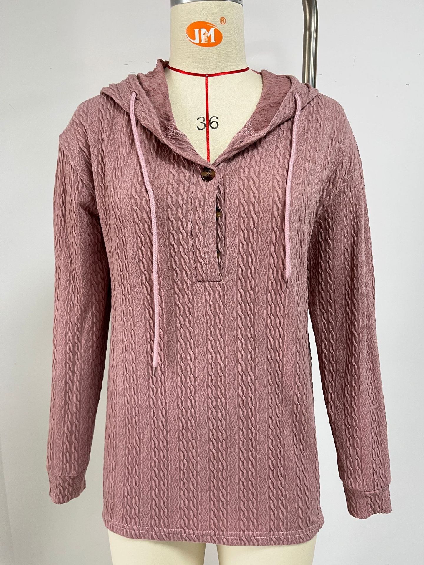Pull à capuche décontracté pour femmes avec surface texturée et détails de boutons Chic und Stil