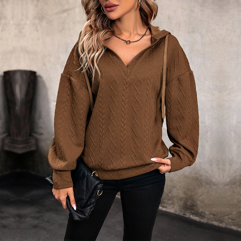 Pull femme avec capuche et design texturé Chic und Stil