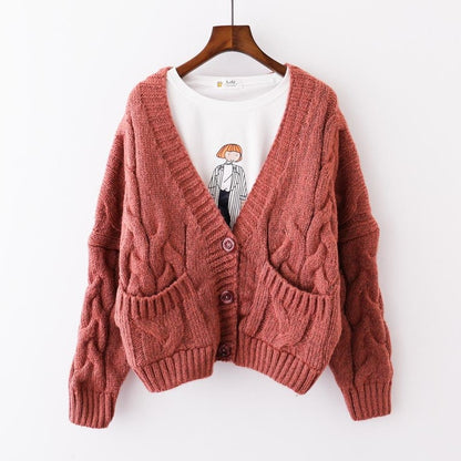 Cardigan femme en grosse maille avec poches décoratives et décoration de boutons Chic und Stil