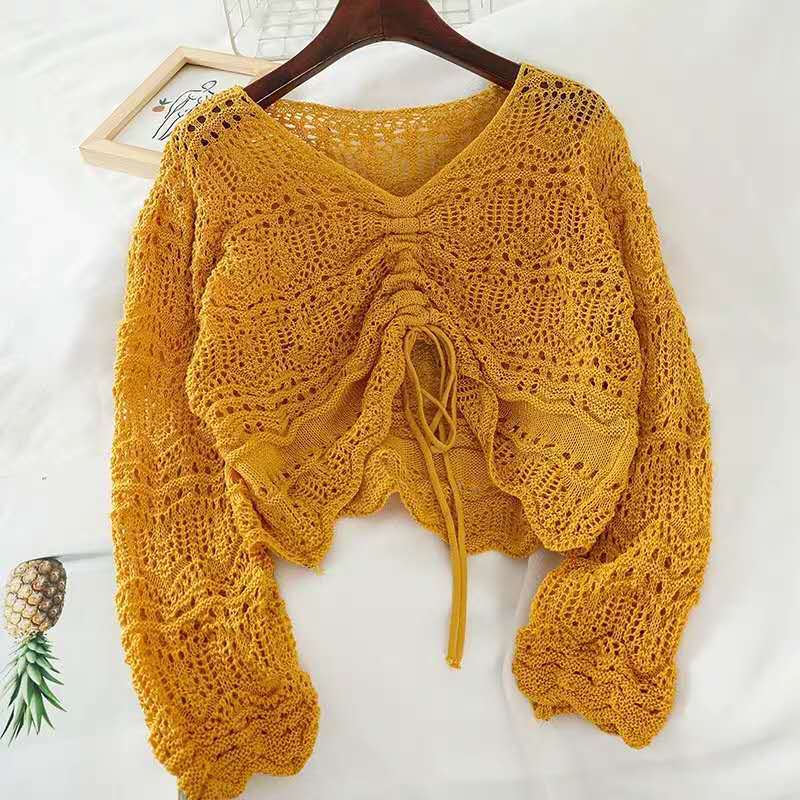 Pull en tricot pour femmes avec un motif de trous décoratif et un cordon réglable Chic und Stil