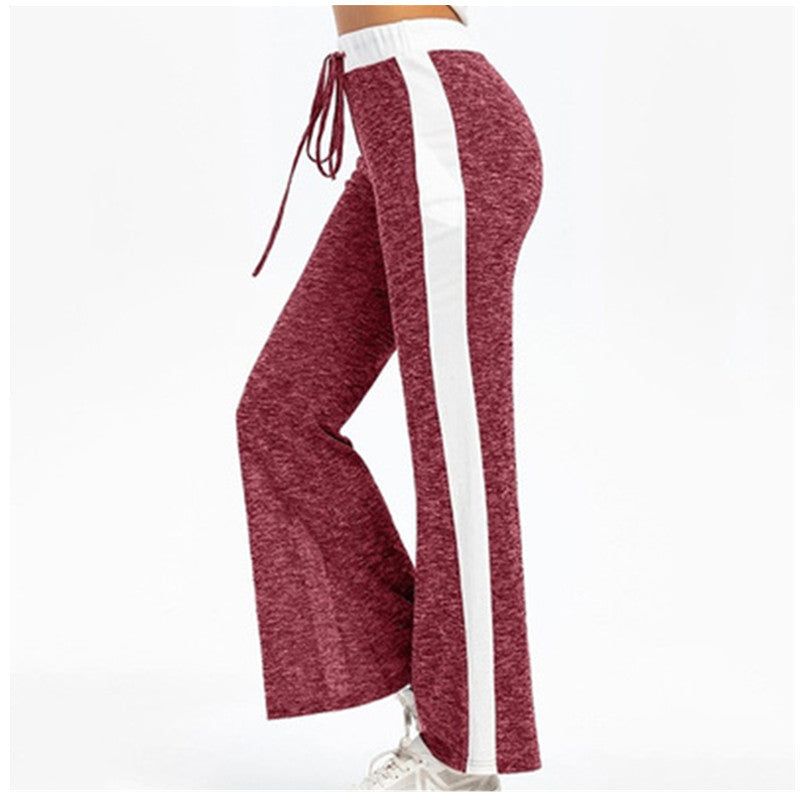 Fluid sports pants for women with side stripes and elastic waist Chic and Style