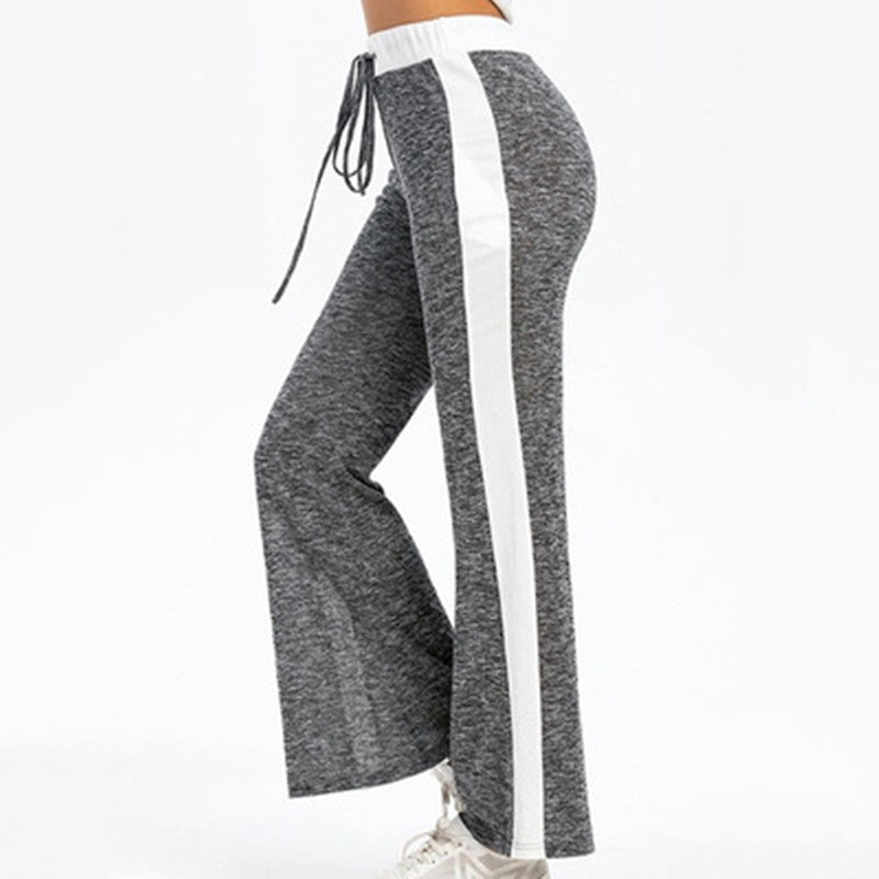 Fluid sports pants for women with side stripes and elastic waist Chic and Style