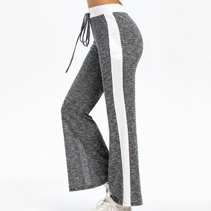 Fluid sports pants for women with side stripes and elastic waist Chic and Style