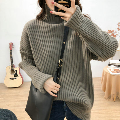 Chunky knit pullover for women with high collar and fine ribbed structure Chic and Style