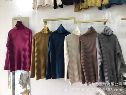 Chunky knit pullover for women with high collar and fine ribbed structure Chic and Style