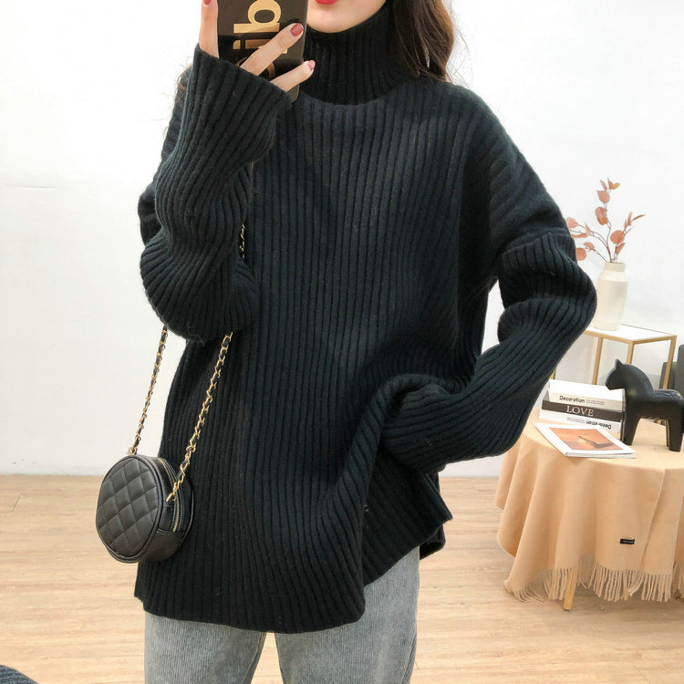 Chunky knit pullover for women with high collar and fine ribbed structure Chic and Style