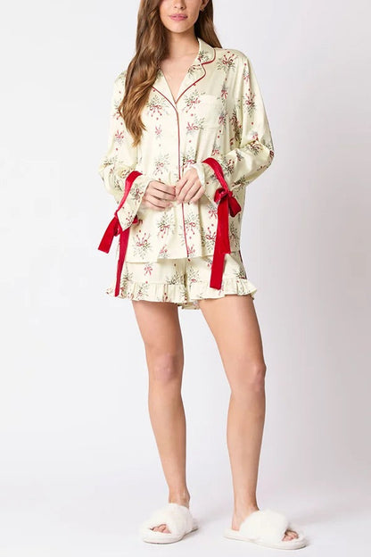 Chic und Stil | Christmas Fashion Printed Bow Tie Top and Elastic Waist Ruffled Shorts Set
