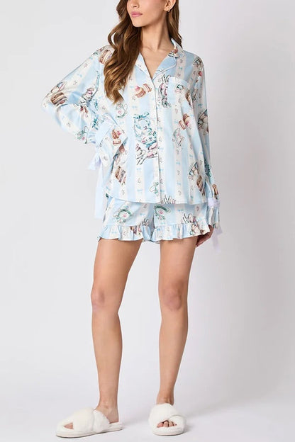 Chic und Stil | Christmas Fashion Printed Bow Tie Top and Elastic Waist Ruffled Shorts Set