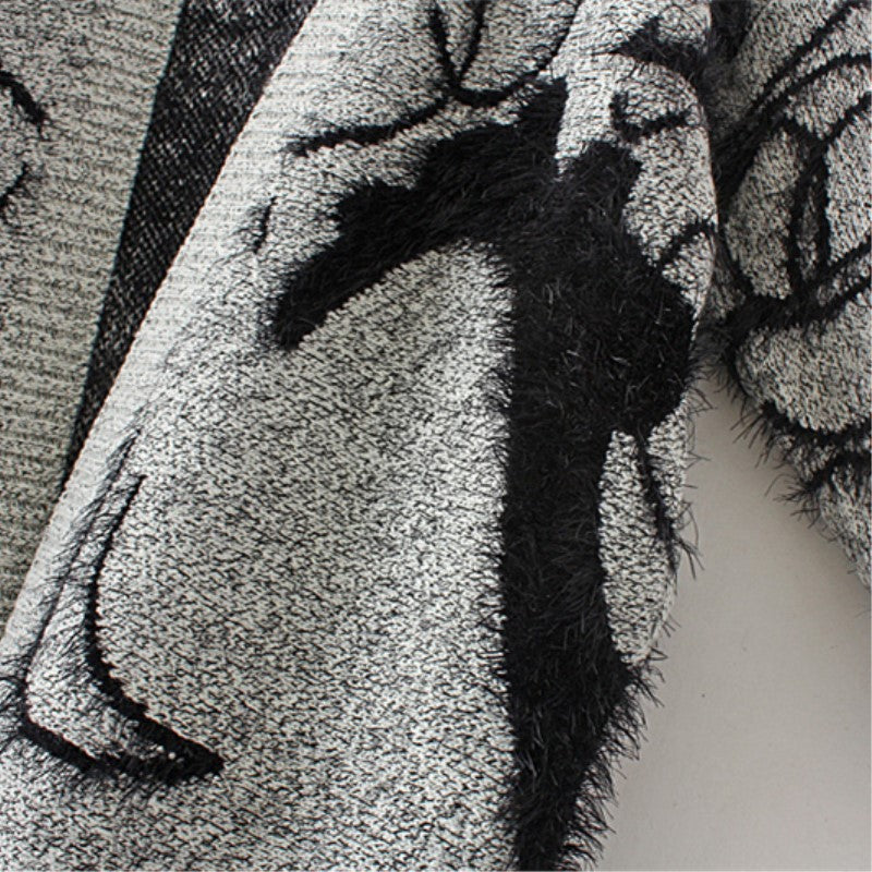 Robe en tricot pour femmes avec un design graphique artistique et un élégant décolleté en V Chic und Stil