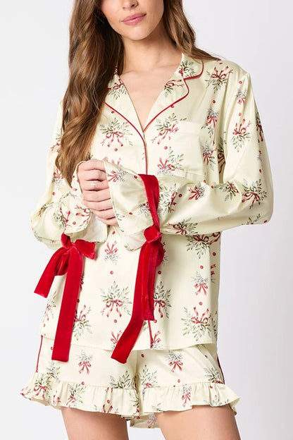 Chic und Stil | Christmas Fashion Printed Bow Tie Top and Elastic Waist Ruffled Shorts Set