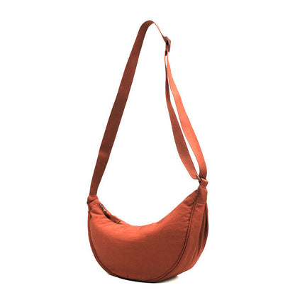 Orange halbmondförmige Tasche