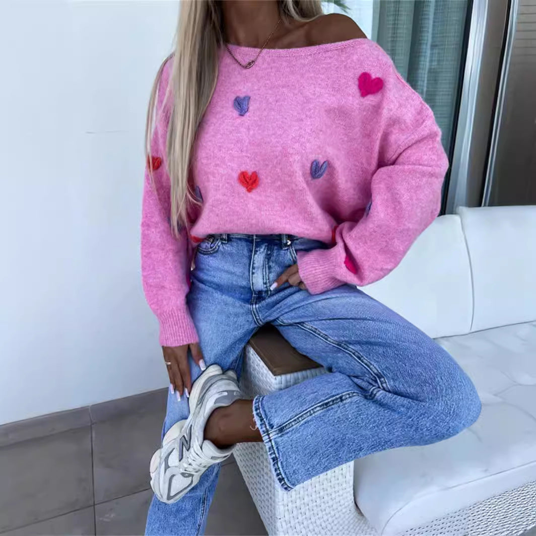 Pull femme avec des cœurs ludiques et une coupe décontractée Chic und Stil