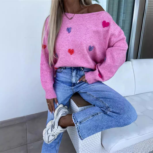 Pull femme avec des cœurs ludiques et une coupe décontractée Chic und Stil