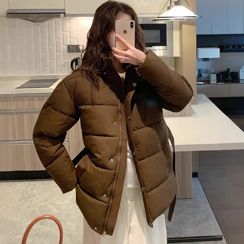 Classic women's down jacket with high collar and practical pockets. Chic and stylish.