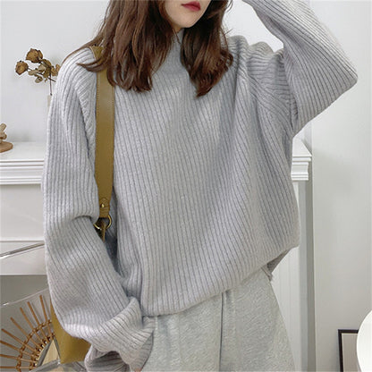 Pull femme décontracté en tricot épais avec col montant et ourlet asymétrique Chic und Stil