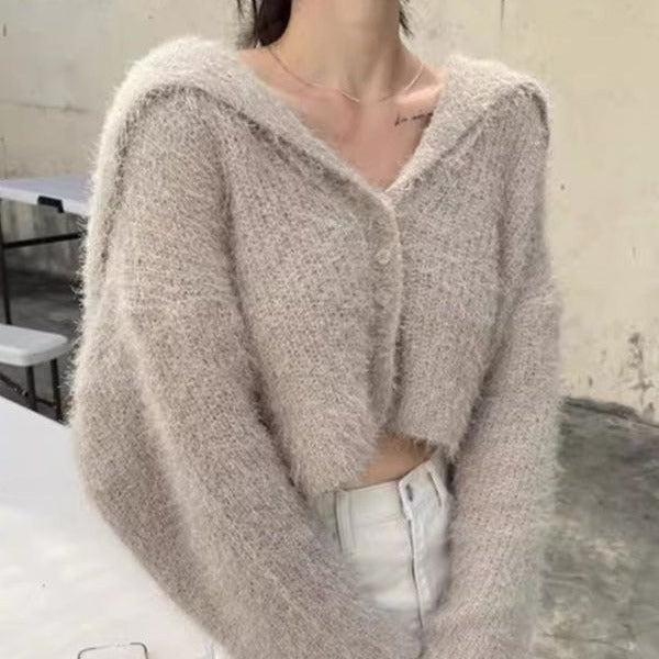 Pull décontracté pour femmes avec décolleté en V profond et motif de mailles texturé Chic und Stil