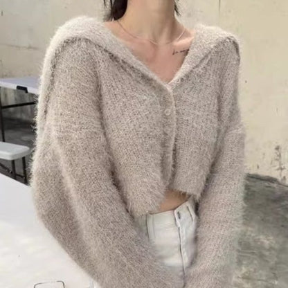 Pull décontracté pour femmes avec décolleté en V profond et motif de mailles texturé Chic und Stil