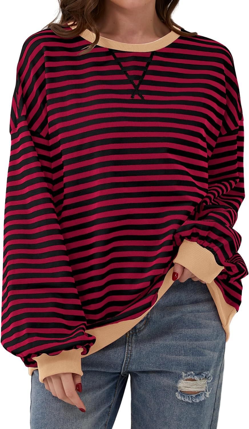 Femme pull décontracté avec motif rayé saisissant et bords élastiques Chic und Stil