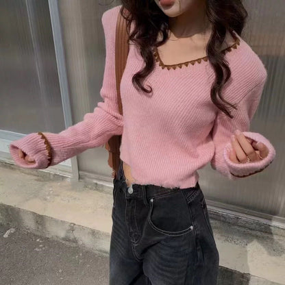 Pull en tricot à col V pour dames avec finitions décoratives Chic und Stil