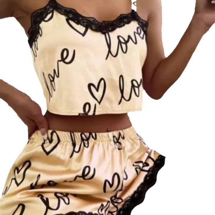 Chic and Style women's satin crop top and shorts set with hearts and lace accents