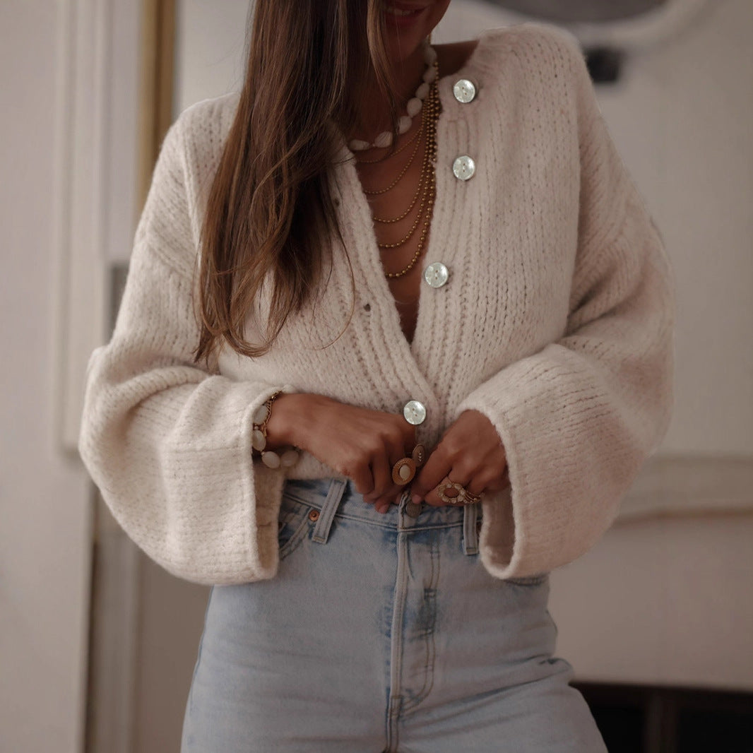 Dames pull-over confortable avec des manches surdimensionnées et de élégants boutons en perles Chic und Stil