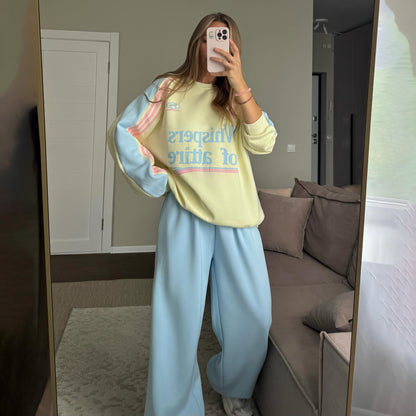 Ladies Casual Sports Outfit with a Relaxed Sweatshirt and Comfortable Jogging Pants Chic and Style