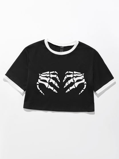 T-shirt cropped pour femmes avec motif de squelette et accents de manches contrastants Chic und Stil