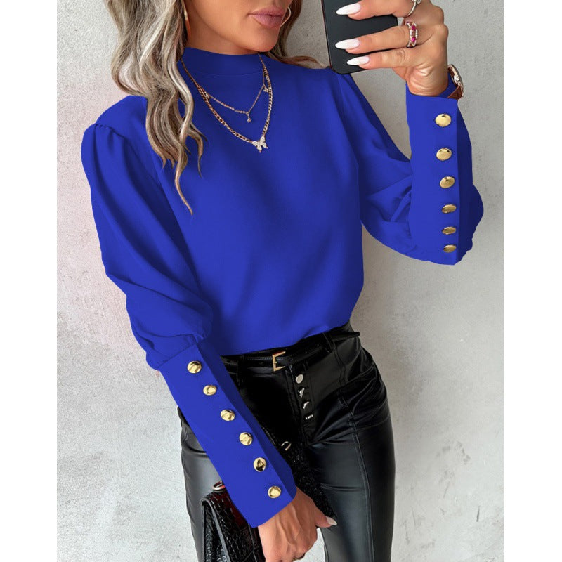 Blouse élégante pour femmes avec des manches bouffantes et des détails de boutons dorés Chic und Stil