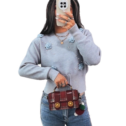 Pull en tricot pour femmes avec des appliqués floraux et des perles brillantes Chic und Stil