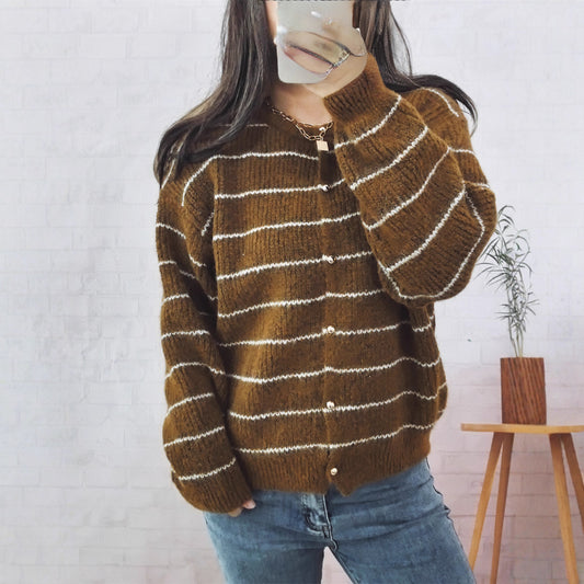 Women's comfortable cardigan with elegant striped pattern and shiny buttons. Chic and stylish.
