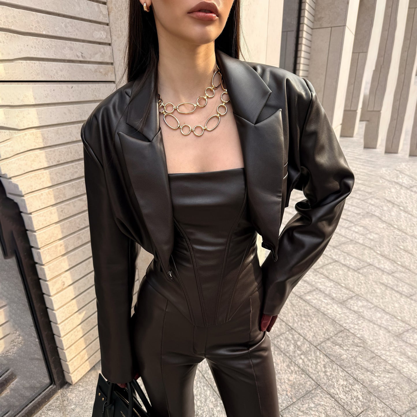 Elegant leather jacket for women with trendy blazer and slim pants