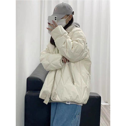 Functional quilted jacket for women with high collar and practical pockets Chic and Style