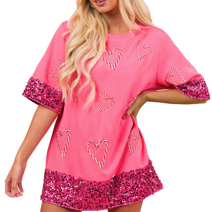 T-shirt de sport féminin avec un motif de cœur espiègle et des manches scintillantes Chic und Stil