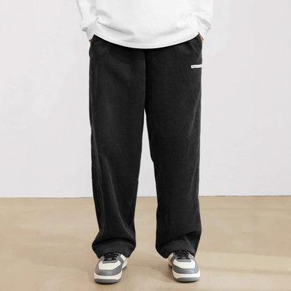 Wide corduroy pants for men with elastic waistband and practical side pockets Chic and Style