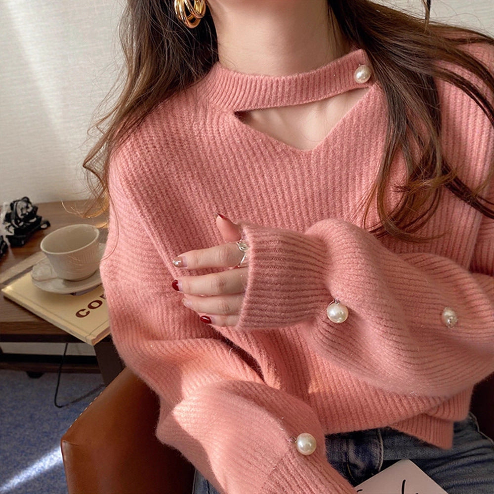 Pull en tricot pour femmes avec un look cut-out raffiné et des manches ornées de perles Chic und Stil