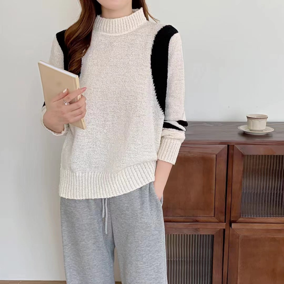 Pull femme avec col montant et manches contrastantes Chic und Stil