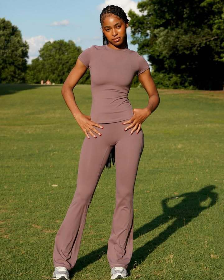 Chic and Style ladies' sporty outfit with fitted top and flared pants